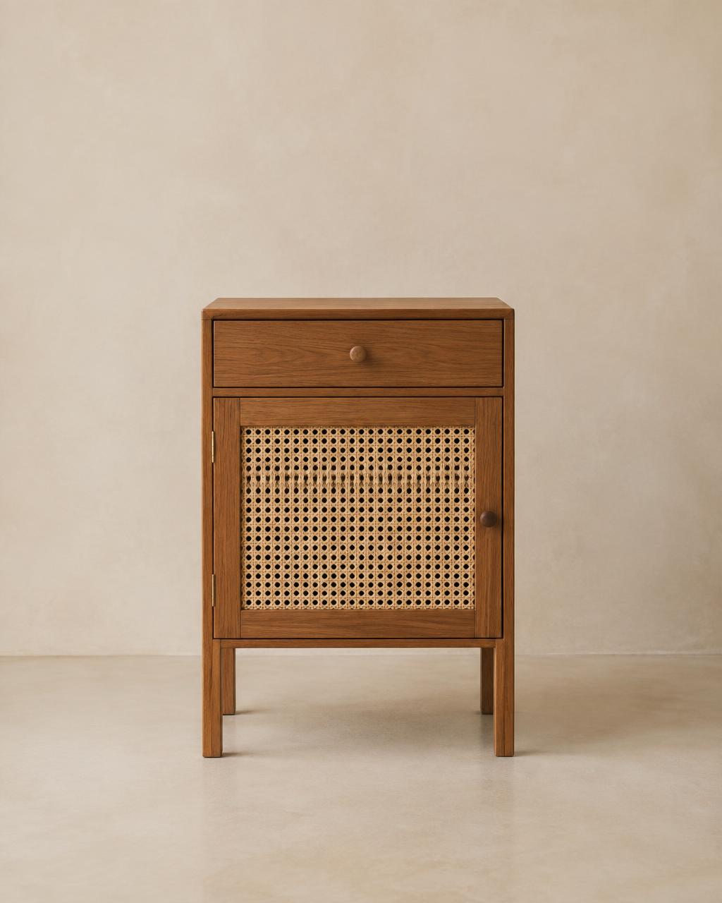 Compact timber bedside table with woven cane door