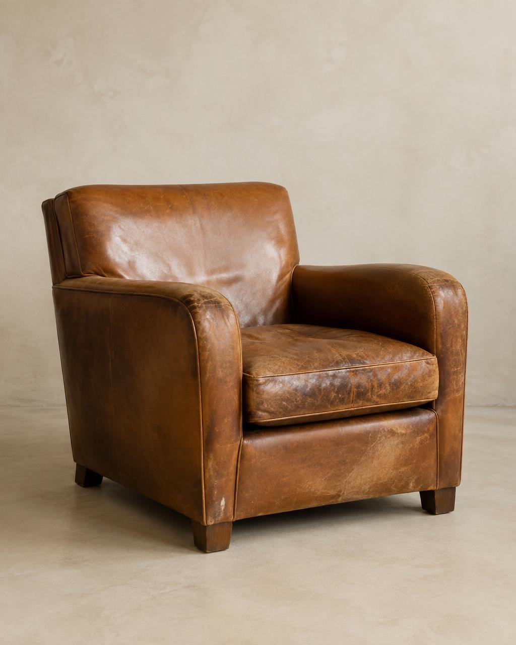 Patinated caramel leather club chair