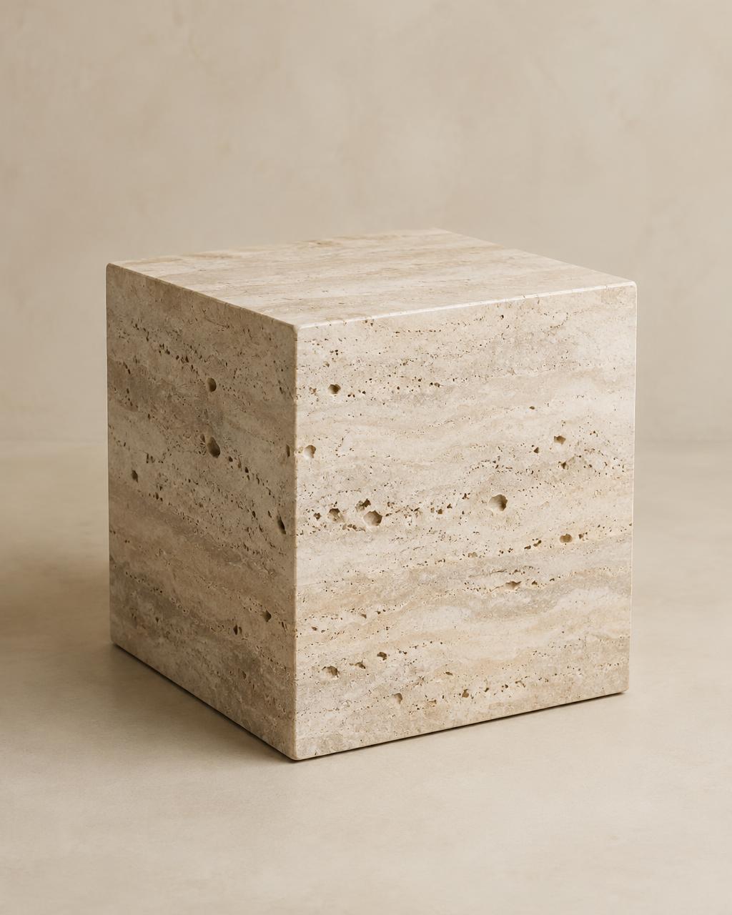 Minimal cube side table carved from pale travertine